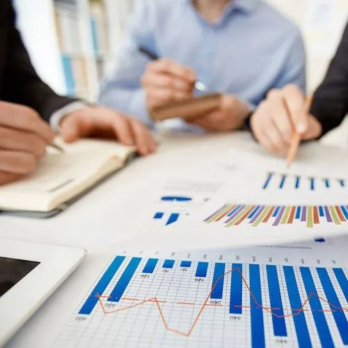 Team analysing charts and reports – value engineering for construction projects
