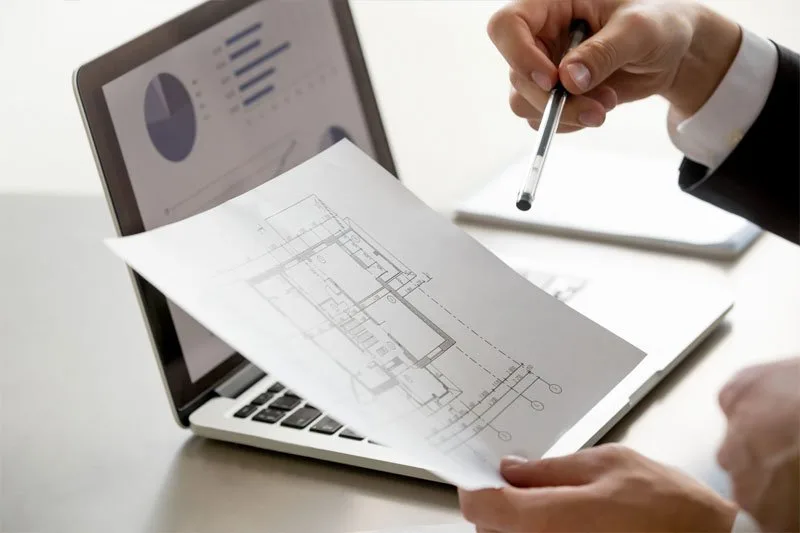 Consultant reviewing approval drawings on a tablet