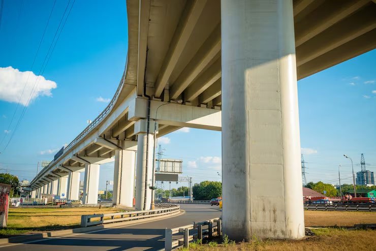Urban flyover with concrete piers seen from below – flyover design consultant